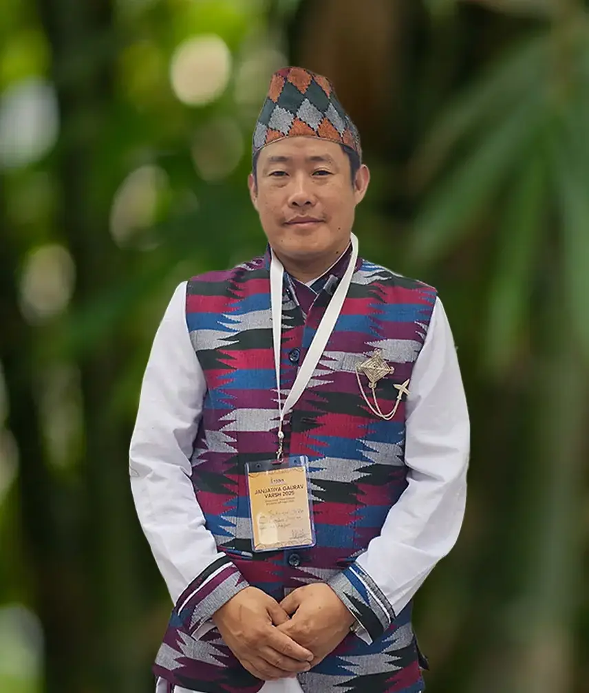 Portrait of Shri Indra Kari Limboo, founder of Khechuperi Bamboo House, in traditional Sikkimese attire